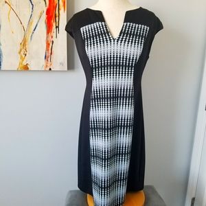 Form fitting dress with slimming front design